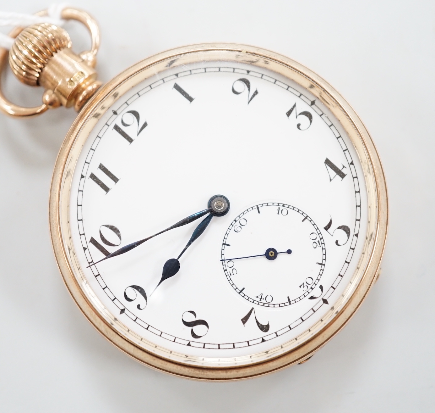 A George V 9ct gold keyless open face pocket watch, with Arabic dial and subsidiary seconds, cased diameter 47mm, gross weight 77.4 grams.